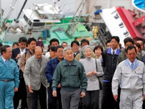 Japan's Emperor Akihito, center left, and Empress Michiko, center right, tour the Otsu fishing port heavily damaged by the March 11 earthquake and tsunami on Friday, April 23, 2011.(AP Photo/Itsuo Inouye)