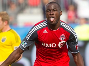 Toronto FC's Tony Tchani, right, celebrates his first half goal during MLS action against the Columbus Crew in Toronto Saturday, April 23, 2011. THE CANADIAN PRESS/Darren Calabrese