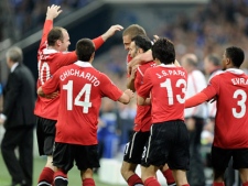Manchester's Wayne Rooney, left, celebrates during the the Champions League semifinal soccer match between FC Schalke 04 and Manchester United in Gelsenkirchen, Germany, Tuesday, April 26, 2011. Schalke was defeated by United 2-0. (AP Photo/Martin Meissner)