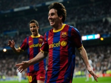 FC Barcelona's Lionel Messi, from Argentina, reacts after scoring against Real Madrid during their semifinal, 1st leg Champions League soccer match at the Bernabeu stadium in Madrid, Spain, Wednesday, April 27, 2011. (AP Photo/Manu Fernandez)