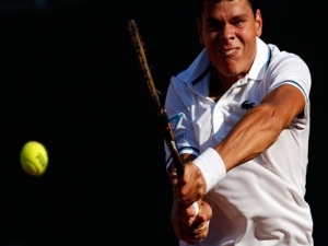 Canada's Milos Raonic returns the ball to Russia's Igor Andreev during their first round match at the Estoril Open tennis tournament Tuesday, April 26, 2011 in Oeiras, outside Lisbon. Raonic won 6-4, 6-4. (AP Photo/ Francisco Seco)