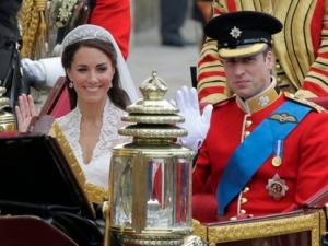 Britain's Prince William and his wife Kate, Duchess of Cambridge, left, wave as they leave Westminster Abbey at the Royal Wedding in London Friday, April 29, 2011. (AP Photo/Alastair Grant)