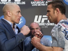 Georges St-Pierre, left, poses with Jake Shields during a UFC press conference in Toronto on Wednesday, April 27, 2011. (THE CANADIAN PRESS/Nathan Denette) 