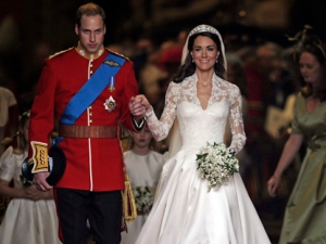 Britain's Prince William and his wife Kate, Duchess of Cambridge stand outside of Westminster Abbey after their Royal Wedding in London Friday, April, 29, 2011. (AP Photo/Martin Meissner)