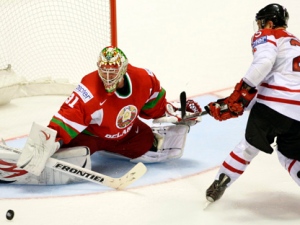 Chris Stewart, right, from Canada fails to score past Andrei Mezin, left, from Belarus during their preliminary round group B Hockey World Championships match in Kosice, Slovakia, Friday, April 29, 2011. Canada won the match 4-1. (AP Photo/Petr David Josek)