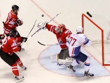 Canada's James Reimer, 2nd right, saves during the preliminary round group B Hockey World Championships match against France in Kosice, Slovakia, Sunday, May 1, 2011. (AP Photo/Petr David Josek)