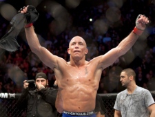 Georges St-Pierre, from Montreal celebrates after defeating Josh Koscheck, from Waynesburg, PA., with a unanimous decision to retain his welterweight title at UFC 124 Sunday, December 12, 2010 in Montreal. The mixed martial arts fight went the distance with St-Pierre winning 50-45 on all three judges' card. (THE CANADIAN PRESS/Ryan Remiorz)