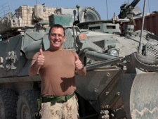 Warrant Officer Gabriel Bernard, of Moncton, New Brunswick, Canada, smiles outside a small Canadian patrol base outside Salavat, Afghanistan, on Monday, May 2, 2011. Osama bin Laden was killed in a helicopter raid on a mansion in an area north of the Pakistani capital, U.S. and Pakistani officials said Monday. "Hopefully, it's a step forward toward world peace and a resolution for the conflict here in Afghanistan," Bernard said. (AP Photo/The Canadian Press, Colin Perkel)