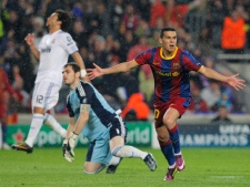 FC Barcelona's Pedro Rodriguez celebrates his goal besides Real Madrid's goalkeeper Iker Casillas and Marcelo from Brazil during a semi final, 2nd leg Champions League soccer match against Real Madrid at the Camp Nou stadium in Barcelona on Tuesday, May 3, 2011. (AP Photo/Andres Kudacki)