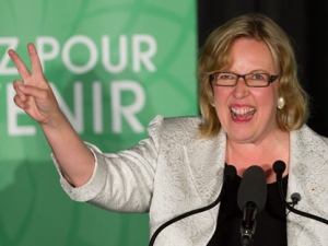 Green Party leader Elizabeth May gives the victory sign as she speaks to supporters after being elected MP for Saanich-Gulf Islands in Sidney, B.C., on Monday May 2, 2011. May defeated Conservative incumbent Gary Lunn to become the first Green Party candidate elected to Parliament in Canada. (THE CANADIAN PRESS/Darryl Dyck)