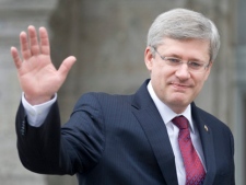 Prime Minister Stephen Harper waves as he arrives at Rideau Hall to meet with the Governor General in Ottawa, Wednesday May 4, 2011. (THE CANADIAN PRESS/Adrian Wyld)