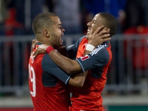 Toronto FC 's  Maicon Santos, left, celebrates with Joao Plata celebrates after scoring his team's second goal  during second  half MLS  action against Houston Dynamo  in Toronto on Saturday May 7, 2011. THE CANADIAN PRESS/Chris Young