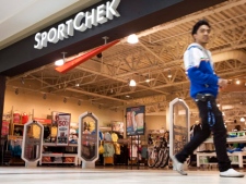 A shopper walks past a Sport Chek store at a Calgary Mall, Wednesday, June 9, 2010. (THE CANADIAN PRESS/Jeff McIntosh)