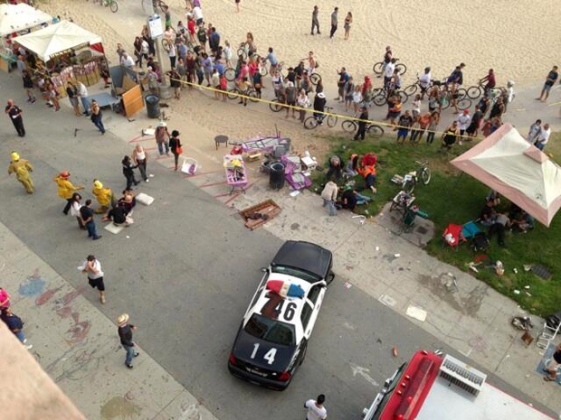 car goes into pedestrioans Venice Beach boardwalk