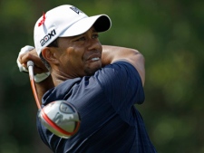 Tiger Woods hits from the ninth tee during the first round of The Players Championship golf tournament Thursday May 12, 2011 in Ponte Vedra Beach, Fla. Woods withdrew after nine holes. (AP Photo/Chris O'Meara)