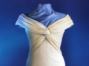 A formal cream coloured silk crepe dinner dress worn by Diana, by designer Catherine Walker, is shown. Canadians will get a last look at dresses once worn by the late Diana, Princess of Wales, in a special exhibit before the famed designer gowns hit the auction block. The Design Exchange is featuring 14 evening dresses from her collection in "The Life of a Royal Icon," which opens Monday. THE CANADIAN PRESS/HO