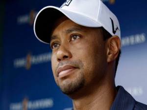 Tiger Woods pauses while speaking to the media after he withdrew after nine holes during the first round of The Players Championship golf tournament Thursday May 12, 2011 in Ponte Vedra Beach, Fla. (AP Photo/Chris O'Meara)