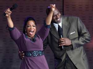 Oprah Winfrey reacts as Michael Jordan appears during a star-studded double-taping of "Surprise Oprah! A Farewell Spectacular," Tuesday, May 17, 2011, in Chicago. "The Oprah Winfrey Show" is ending its run May 25, after 25 years, and millions of her fans around the globe are waiting to see how she will close out a show that spawned a media empire. (AP Photo/Charles Rex Arbogast)