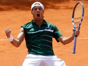 Spain's Ruben Ramirez Hidalgo reacts as he defeats Croatia's Marin Cilic in a first round match of the French Open tennis tournament, at the Roland Garros stadium in Paris, Sunday, May, 22, 2011. (AP Photo/Michel Spingler)