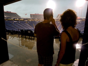 Spectators watch thunderstorms from under shelter at the Rexall Centre as a tornado warning delays play in Rogers Cup tennis action in Toronto on Thursday August 20, 2009. The venue will host a new summer music festival. (THE CANADIAN PRESS/Frank Gunn)