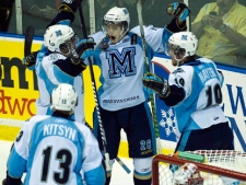 Mississaugua St. Michael's Majors Rob Flick, top centre, celebrates his goal with teammates as Owen Sound Attack goalie Jordan Binnington, front right, looks down during second period Memorial Cup hockey action in Mississauga, Ont., on Wednesday, May 25, 2011. (THE CANADIAN PRESS/Nathan Denette)