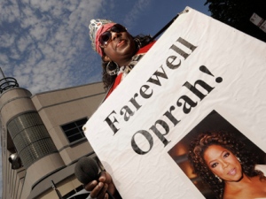 Kimberly Adams of Chicago stands outside Harpo Studios before the final taping of "The Oprah Winfrey Show" in Chicago, Tuesday, May 24, 2011. The finale will air on Wednesday. (AP Photo/Paul Beaty)