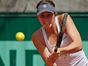 Rebecca Marino of Canada returns the ball against Kateryna Bondarenko of the Ukraine in the first round match of the French open tennis tournament at Roland Garros stadium in Paris, Sunday May 22, 2011. (AP Photo/Christophe Ena)