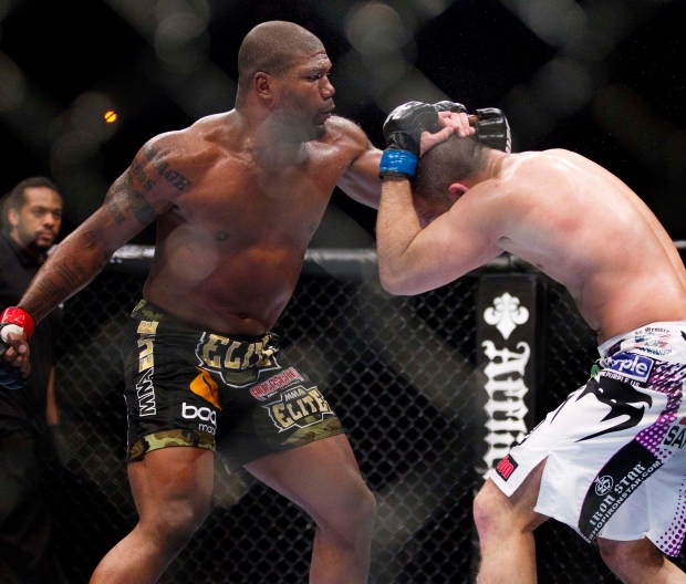 Quinton Jackson throws a series of punches against Matt Hamill in the third round of a mixed martial arts light heavyweight bout at UFC 130, Saturday, May 28, 2011, in Las Vegas. Jackson won by unanimous decision. (AP Photo/Julie Jacobson)