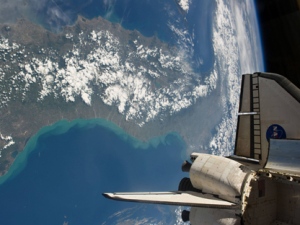 This Thursday, May 19, 2011 picture provided by NASA shows the space shuttle Endeavour docked with the International Space Station and Italy seen in the background. (AP Photo/NASA)