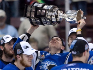 Saint John Sea Dogs player Nathan Beaulieu hoists the Memorial Cup after defeating the Mississauga St. Michael's Majors in the Memorial Cup final in Mississauga, Ont., Sunday, May 29, 2011. (THE CANADIAN PRESS/Darren Calabrese)