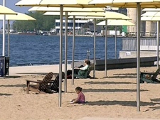 Sun seekers soak up the sun at HtO Park in downtown Toronto, Tuesday, May 31, 2011. Environment Canada issued a humidex warning Tuesday. 