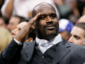 This Dec. 5, 2005, file photo shows Miami Heat's injured center Shaquille O'Neal saluting a fan during the game against the Los Angeles Clippers, in Los Angeles. O'Neal says on Twitter that he's "about to retire."(AP Photo/Kevork Djansezian, File)