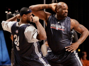 This Feb. 17, 2007, file photo, shows Shaquille O'Neal, right, of the Miami Heat, and LeBron James, of the Cleveland Cavaliers, dancing together during NBA All-Star basketball practice in Las Vegas. (AP Photo/Kevork Djansezian, File)