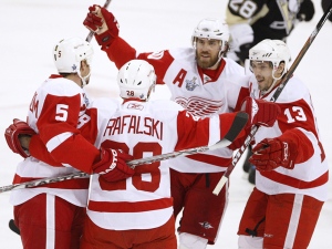 Detroit Red Wings defenceman Nicklas Lidstrom (5),of Sweden, Henrik Zetterberg, centre, of Sweden, and Pavel Datsyuk, from Russia, right, celebrate a goal against the Pittsburgh Penguins by teammate defenceman Brian Rafalski during first period of Game 6 NHL Stanley Cup Finals, in Pittsburgh on Wednesday, June 4, 2008. (Frank Gunn / THE CANADIAN PRESS)