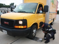 A commercial truck is inspected during an Operation Corridor campaign by Ontario Provincial Police and the Ministry of Transportation. (File)