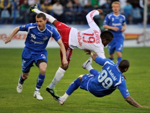 New York Red Bulls' Dane Richards collides with Montreal Impact's Kevin Hatchi as Impacts' Simon Gatti during first half of a friendly soccer game Wednesday, May 11, 2011 in Montreal. THE CANADIAN PRESS/Paul Chiasson