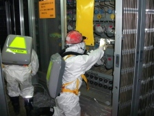 In this May 10, 2011 file photo released by Tokyo Electric Power Co., workers check the status of the water level indicator at the Unit 1 reactor building at the Fukushima Dai-ichi nuclear power plant in Okuma town, Fukushima Prefecture, northeastern Japan. (AP Photo/Tokyo Electric Power Co., File) 