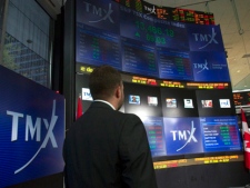 TMX Broadcast Centre manager Kris Backus pauses in front of the centre's display board in Toronto on Monday May 16, 2011. (THE CANADIAN PRESS/Frank Gunn)