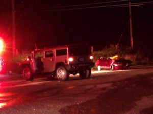 A Hummer, left, and a Hyundai car collided at Highway 7 and Salem Road in Pickering on Monday, June 20, 2011, sending the Hyundai's male driver to hospital in critical condition, OPP said. (CP24/Tom Stefanac)