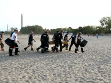 A 15-year-old girl is carried to an ambulance after she was rescued from the water at Woodbine Beach on Tuesday, June 21, 2011.