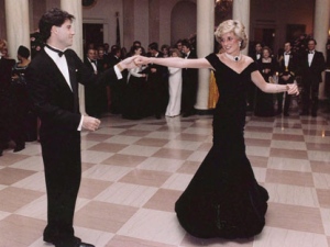 In this Nov. 9, 1985 photo provided by the Ronald Reagan Library, actor John Travolta is shown dancing with Princess Diana, wearing a long, formal dinner dress of blue silk velvet by designer Victor Edelstein, at a White House dinner. (THE CANADIAN PRESS/AP, Ronald Reagan Library)