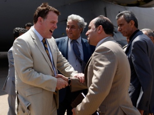 Canada's Minister of Foreign Affairs John Baird, left, arrives at Benina airport in Benghazi, Libya, Monday, June 27, 2011. Others are unidentified. (AP Photo/Hassan Ammar)