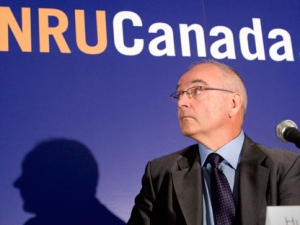 Atomic Energy of Canada Limited President and CEO Hugh MacDiarmid watches a video during a news conference in Toronto on Wednesday July 8, 2009. The federal government has sold nuclear company Atomic Energy of Canada Ltd. to Montreal-based engineering giant SNC-Lavalin Group. (THE CANADIAN PRESS/Frank Gunn)