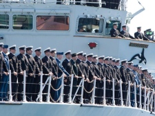 Sailors on the HMCS Vancouver watch the HMCS Algonquin destroyer and Governor General and Commander-in-Chief of the Canadian Forces Michaelle Jean pass by in Victoria, B.C., Saturday, June. 12, 2010, during an international fleet review celebrating 100 years of the Navy in Canada. (THE CANADIAN PRESS/Geoff Howe)