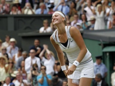 Petra Kvitova of the Czech Republic celebrates defeating Russia's Maria Sharapova in the ladies' singles final at the All England Lawn Tennis Championships at Wimbledon, Saturday, July 2, 2011. (AP Photo/Anja Niedringhaus)