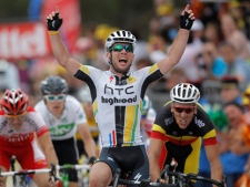 Mark Cavendish of Britain celebrates winning the fifth stage of the Tour de France cycling race over 164.5 kilometers (102.2 miles) starting in Carhaix and finishing in Cap Frehel, Brittany, western France, Wednesday July 6, 2011. (AP Photo/Christophe Ena)