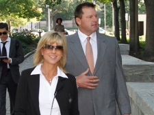 Former Major League Baseball pitcher Roger Clemens, left, with his wife Debbie Clemens, arrives at federal court in Washington, Thursday, July 7, 2011, for his trial on charges of lying to Congress in 2008 when he denied ever using performance-enhancing drugs. (AP Photo/Alex Brandon)