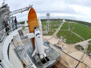 Space Shuttle Atlantis is seen on the pad at the Kennedy Space Center at Cape Canaveral, Fla. , Thursday July 7, 2011. Atlantis and a crew of four are scheduled to launch on Friday, July 8, on the 135th and final space shuttle launch for NASA. (AP Photo/Stan Honda, Pool)