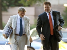 Former Major League Baseball pitcher Roger Clemens, right, and his attorney Rusty Hardin, arrives at federal court in Washington, Thursday, July 14, 2011, for Clemens' perjury trial. (AP Photo/Alex Brandon)