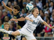 Philadelphia Union's Stefani Miglioranzi, left, and Vancouver Whitecaps' Terry Dunfield jump for the ball during the first half of a MLS soccer game in Vancouver, B.C., on Saturday June 18, 2011. The Vancouver Whitecaps made another change to their MLS roster Thursday by trading midfielder Terry Dunfield, their only player born in Vancouver, to Toronto FC for allocation money and future considerations. (THE CANADIAN PRESS/Darryl Dyck)